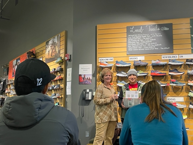 Linda at a sneaker store with a group of people