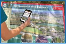 A person taking a picture of the map