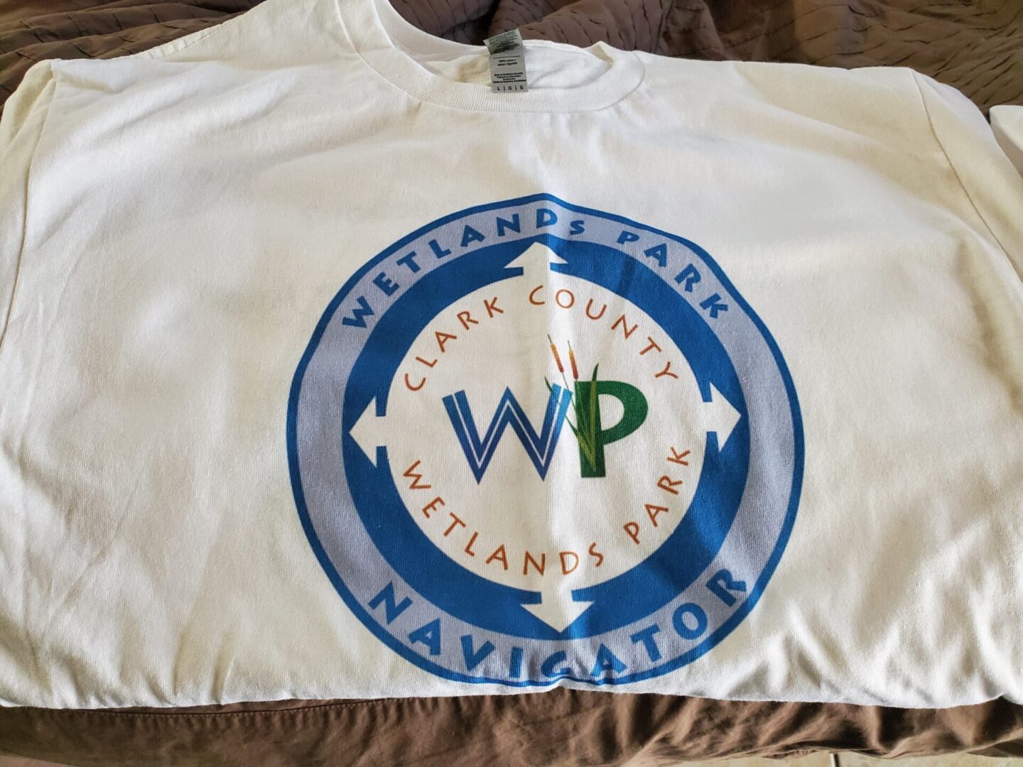 A white t - shirt with the word wp on it.