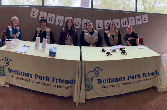 Volunteers at Wetlands Park information booth.