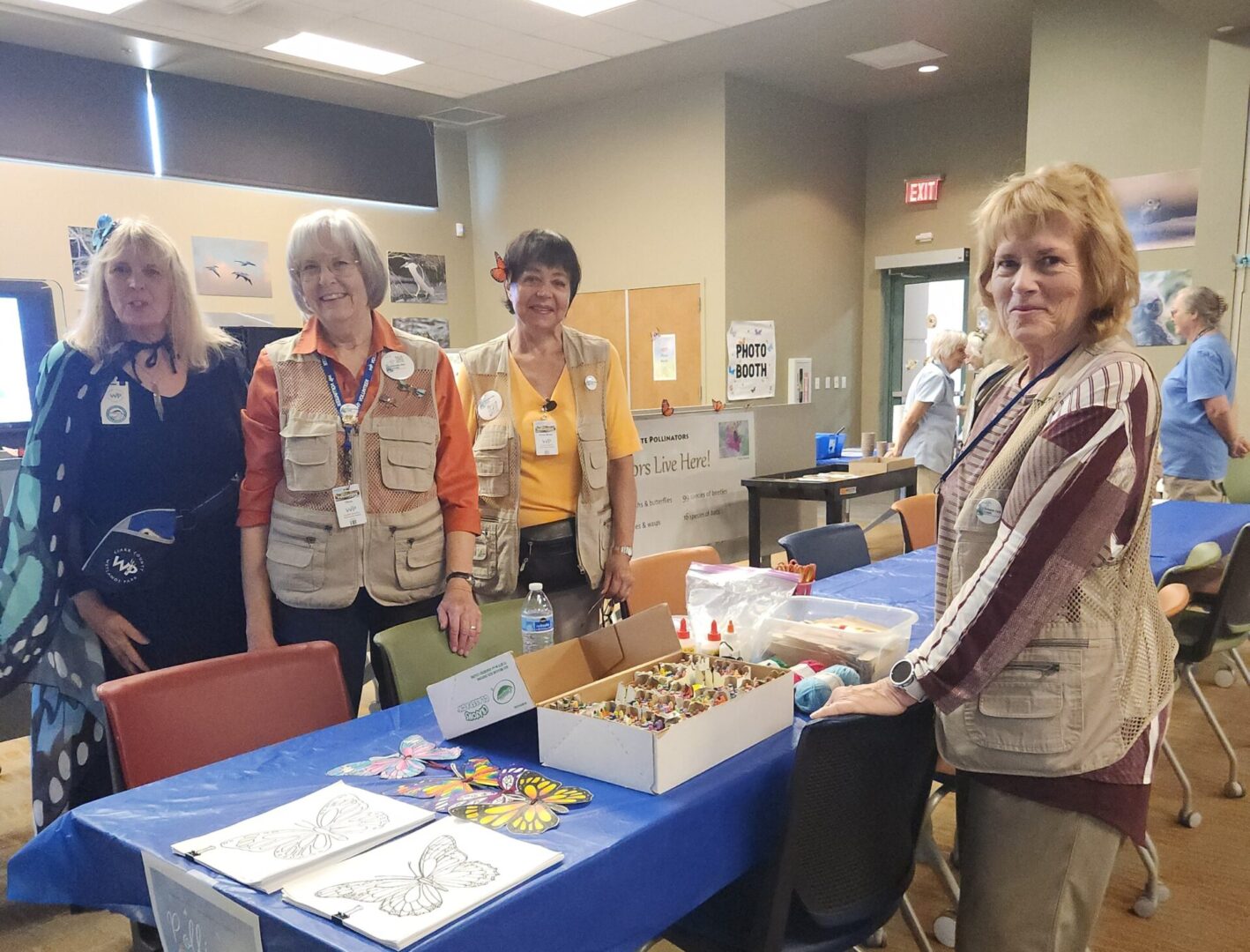 Four women in a community gathering room.