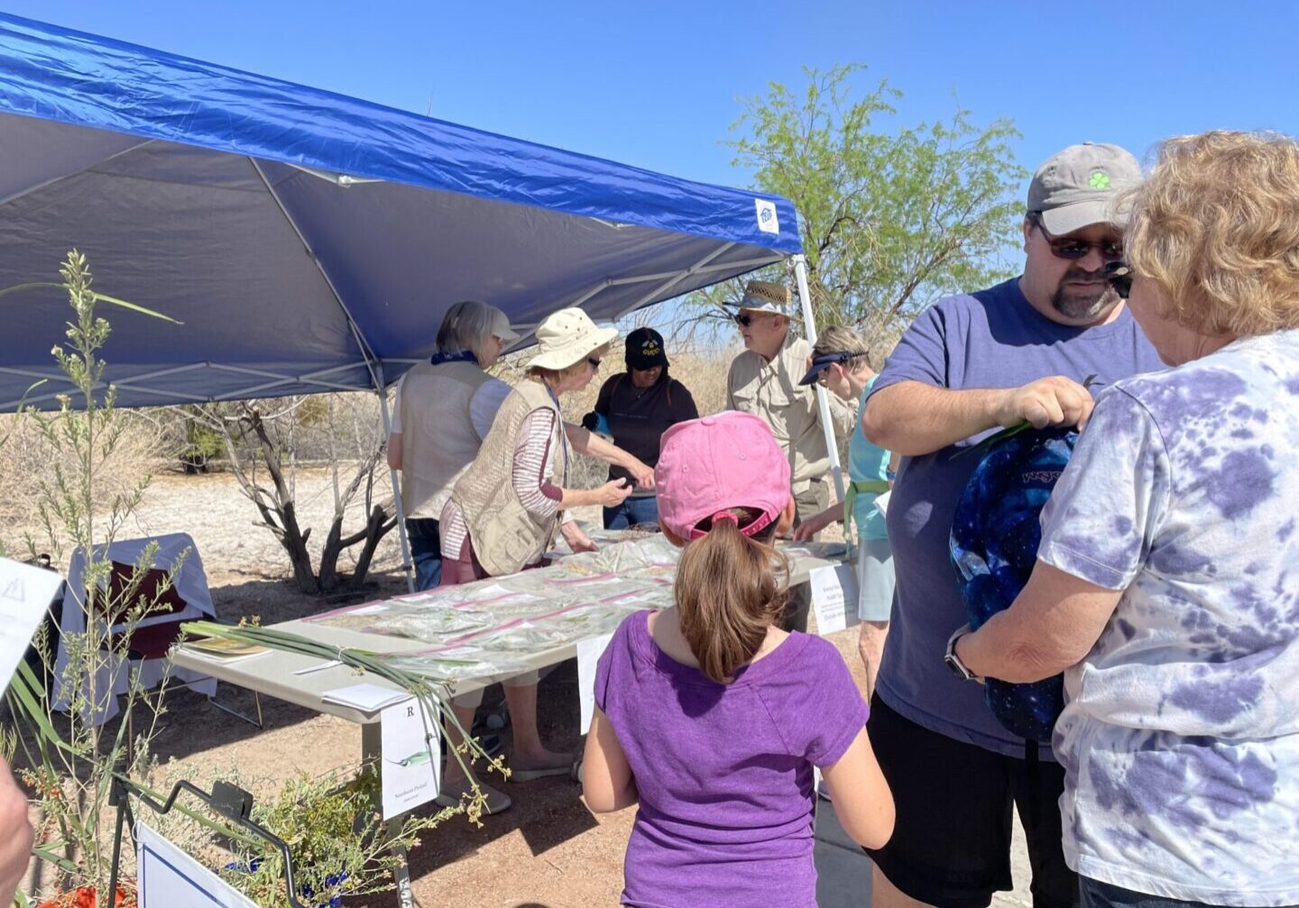 Friends Query Attendees on Plants for Gifts at BioBlast