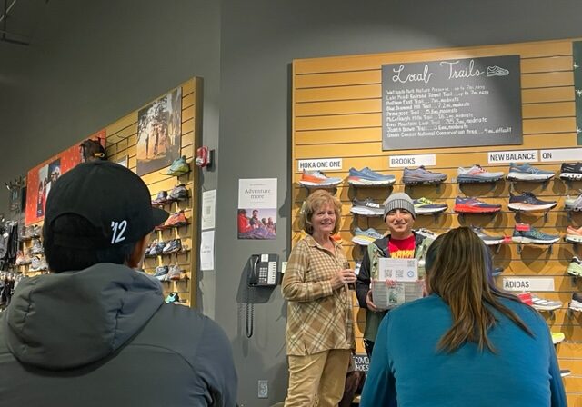 Linda at a sneaker store with a group of people