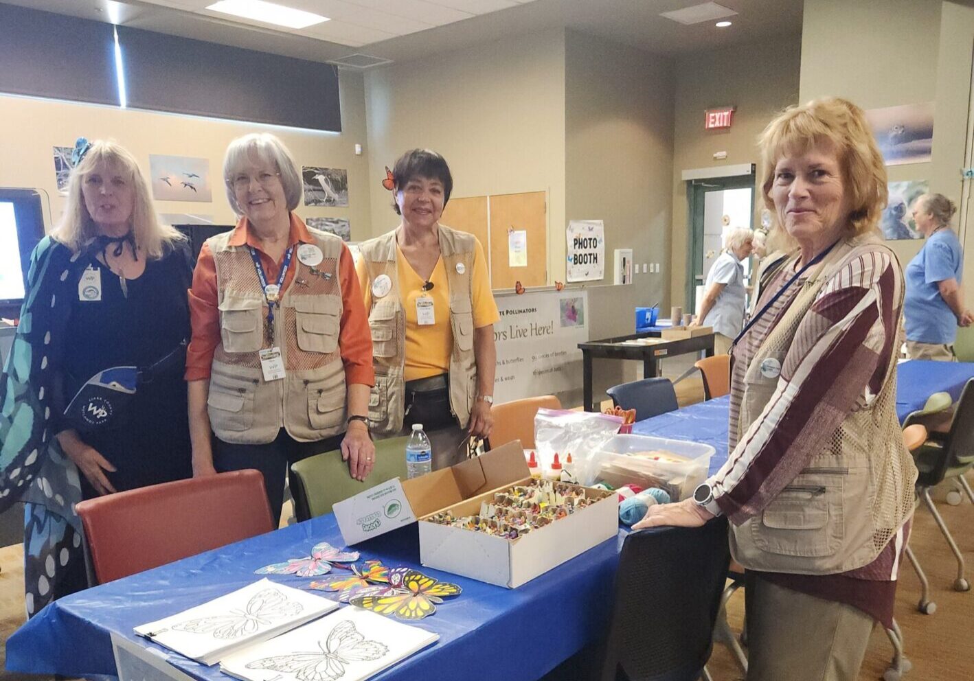 Four women in a community gathering room.