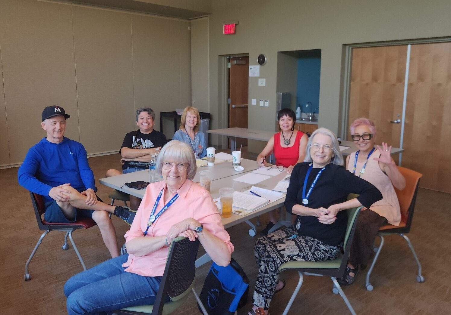 Group of people sitting around a table.